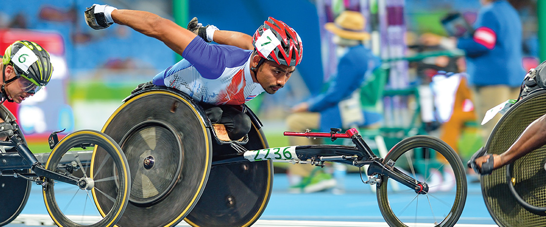 Photo of people in wheelchair vehicles racing