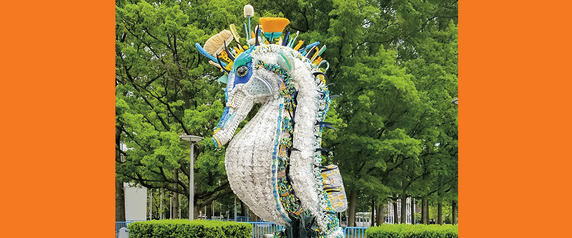 Image of a seahorse made out of pieces of trash